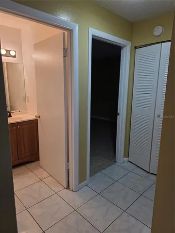 a bathroom with a granite countertop shower and a toilet