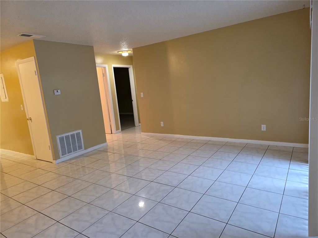 1836 Southwest 109th Place Ocala, FL 34476 - Photo 5 of 24 a view of a livingroom with an empty space and a window
