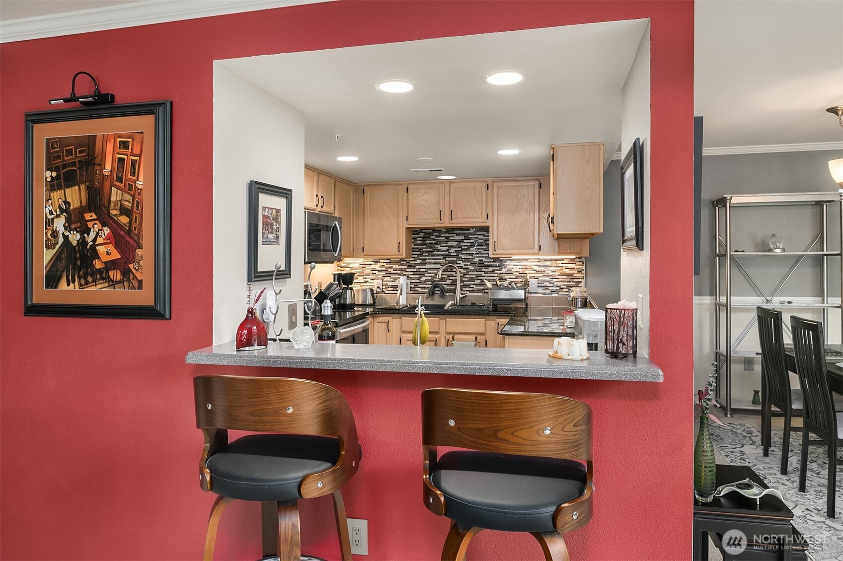 4109 224th Lane Southeast, Unit 213 Issaquah, WA 98029 - Photo 15 of 34 a kitchen with stainless steel appliances granite countertop a sink cabinets and wooden floor
