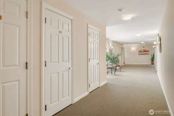a view of a livingroom with a furniture and floor to ceiling window