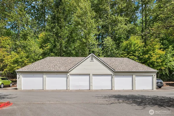 a house that has a tree in front of it