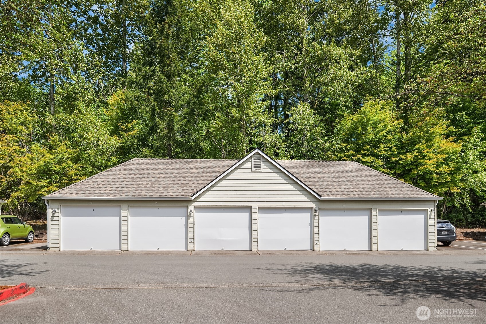 4109 224th Lane Southeast, Unit 213 Issaquah, WA 98029 - Photo 22 of 34 a house that has a tree in front of it