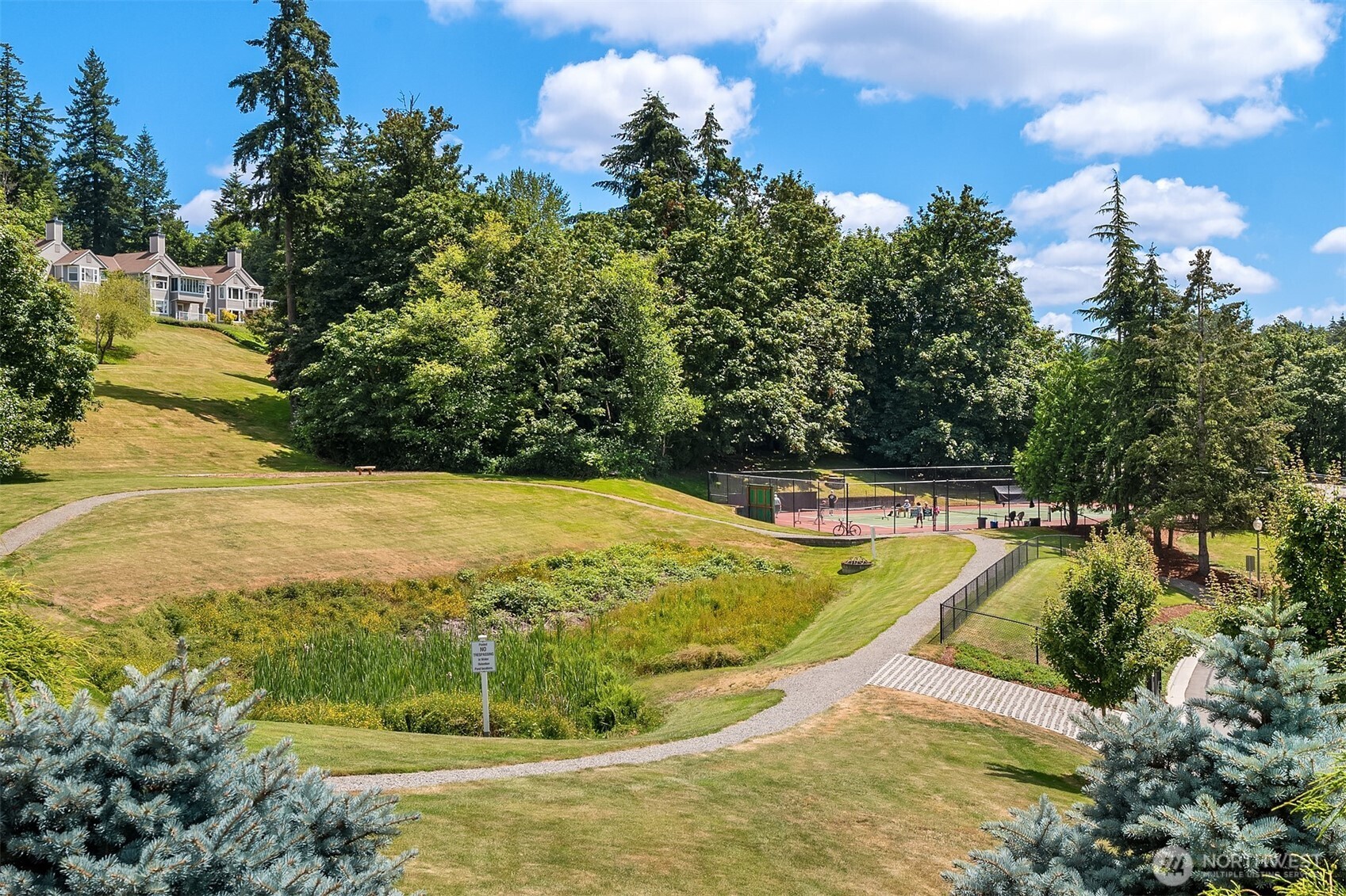 4109 224th Lane Southeast, Unit 213 Issaquah, WA 98029 - Photo 27 of 34 a view of a swimming pool with an outdoor seating and yard