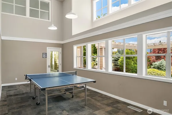 a view of a room with furniture and windows