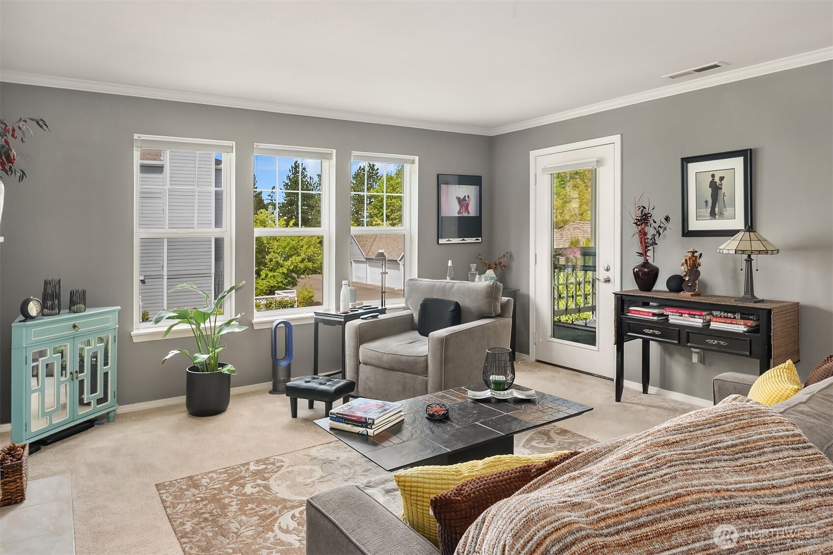 4109 224th Lane Southeast, Unit 213 Issaquah, WA 98029 - Photo 3 of 34 a bedroom with furniture and large windows