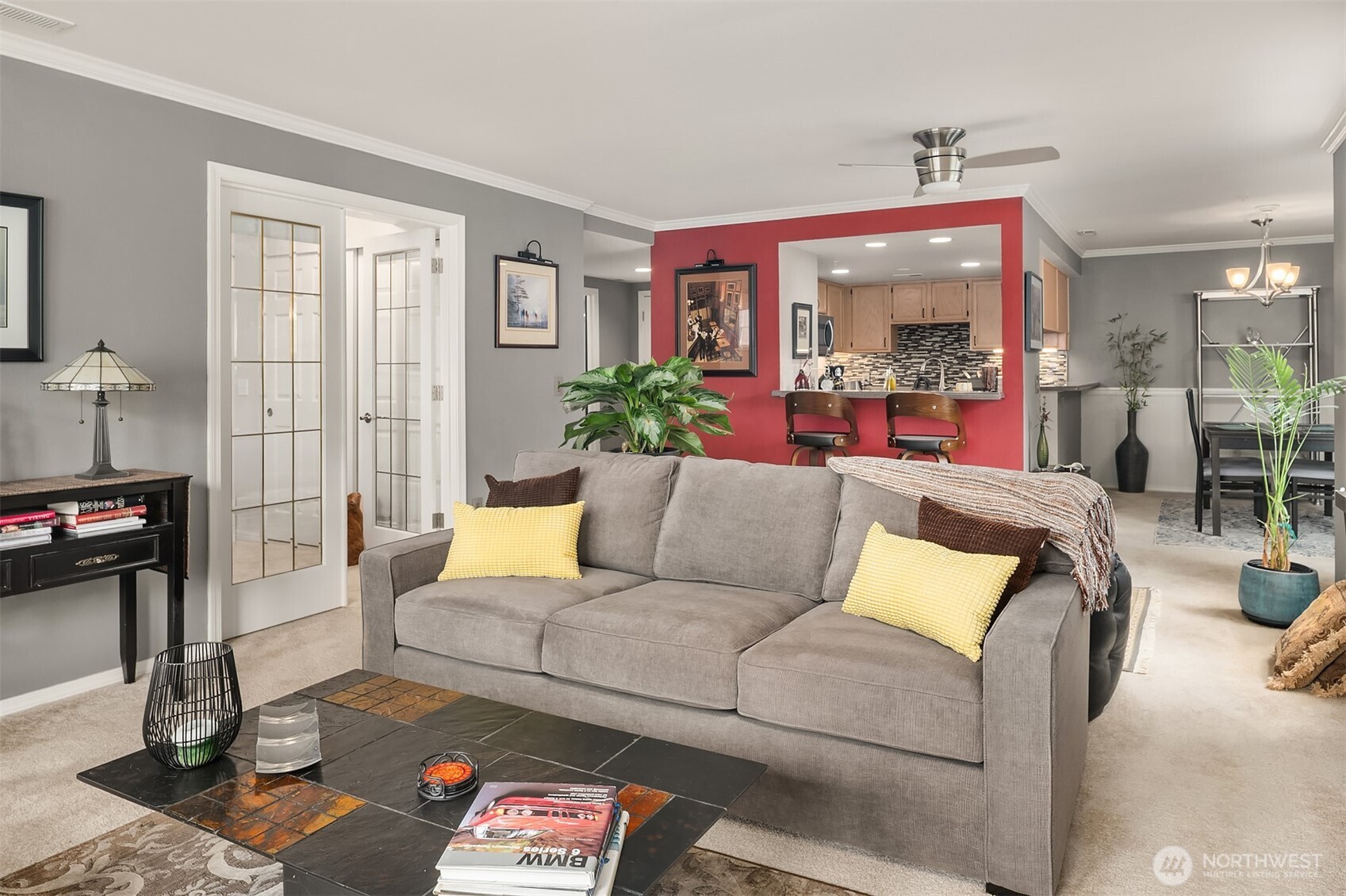 4109 224th Lane Southeast, Unit 213 Issaquah, WA 98029 - Photo 5 of 34 a living room with furniture and a floor to ceiling window