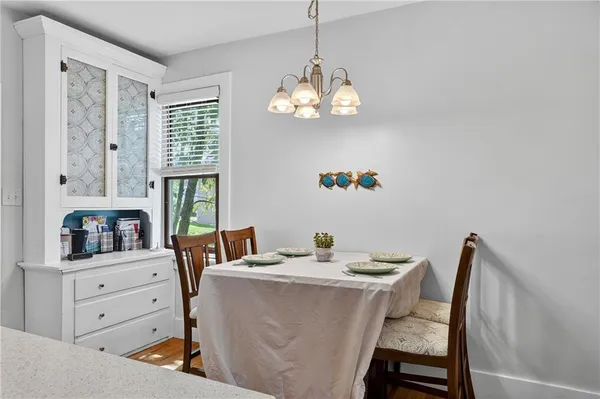 a dining room with furniture and window