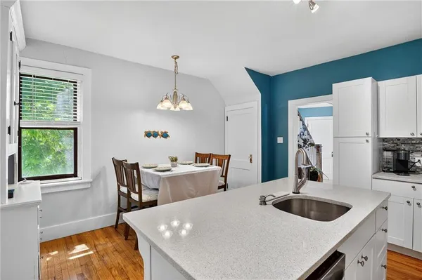 a view of a dining room with furniture and window