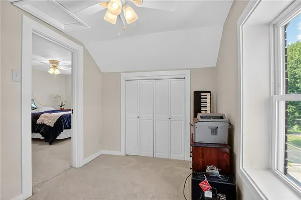 a bed room with furniture and a window