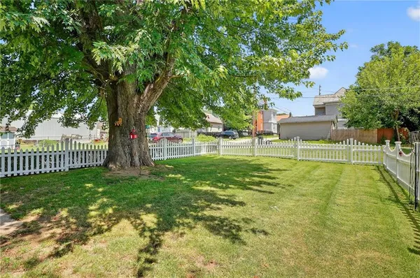 a view of a yard with swimming pool