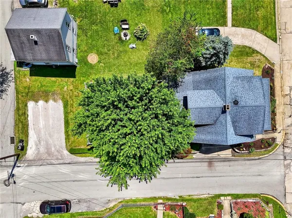 an aerial view of a house with a garden