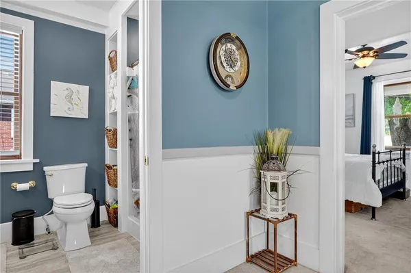 a view of bathroom with furniture and wooden floor