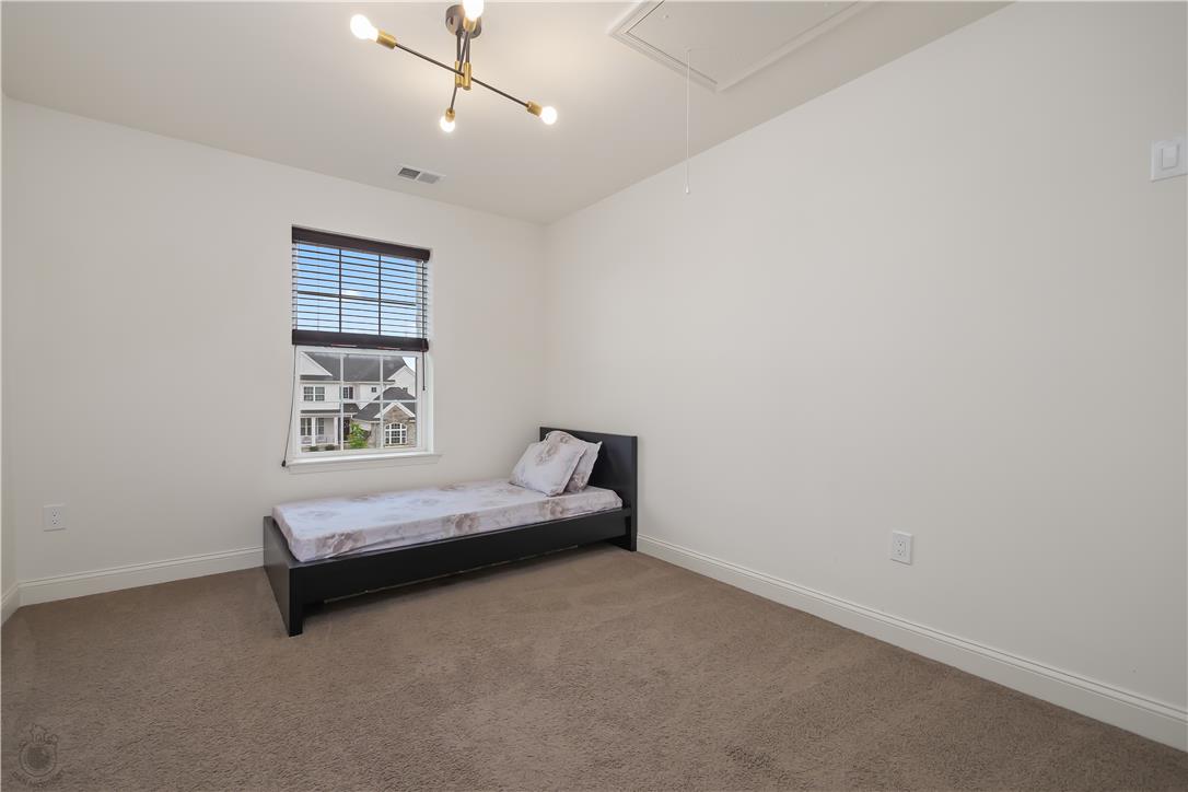 640 Rinaldi Lane Easton, PA 18040 - Photo 29 of 42 A naturally illuminated bedroom offers soft carpet and a clean, minimalist aesthetic.