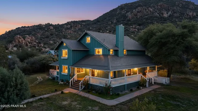 an aerial view of a house with roof deck front of house