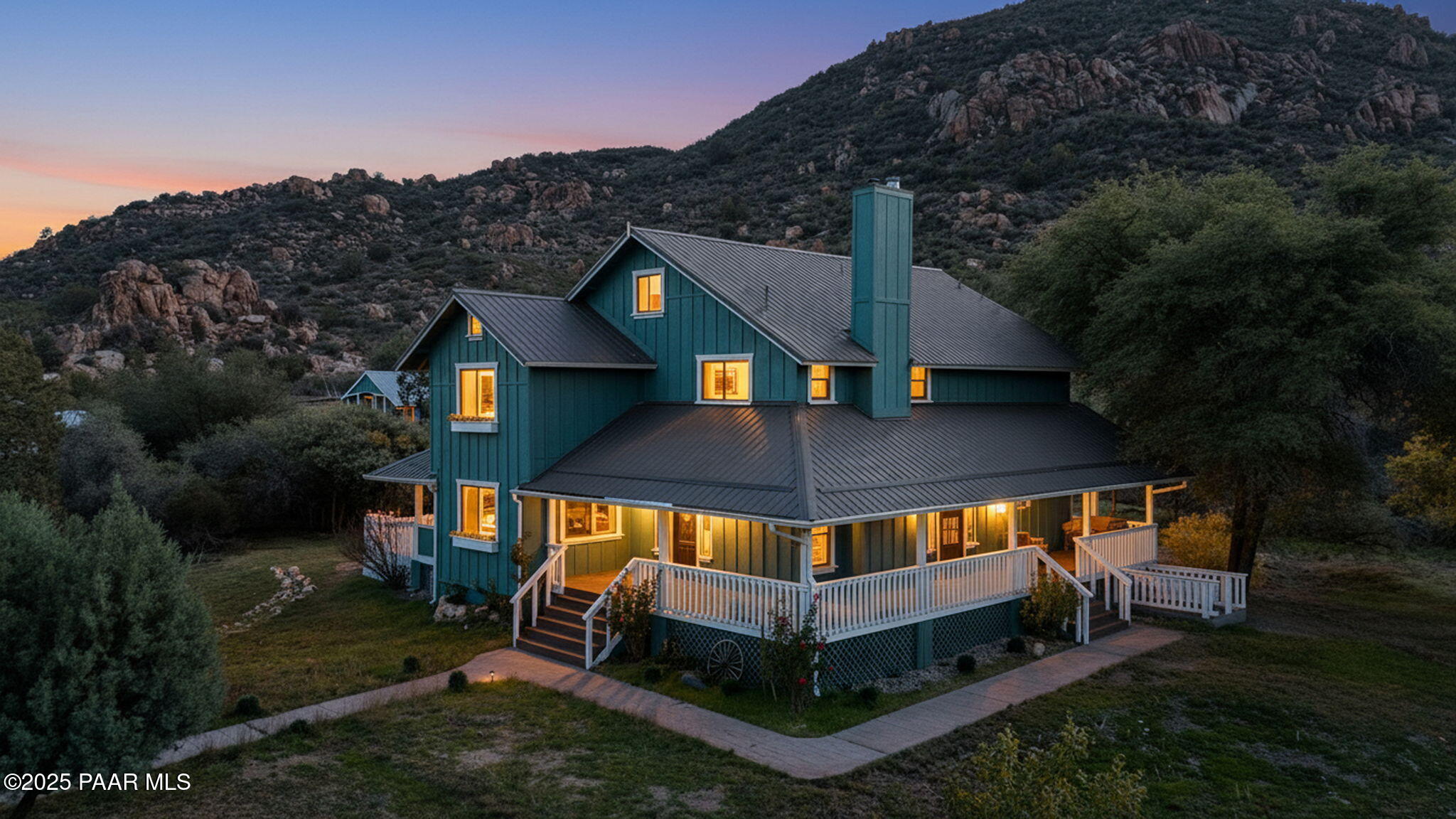 an aerial view of a house with roof deck front of house