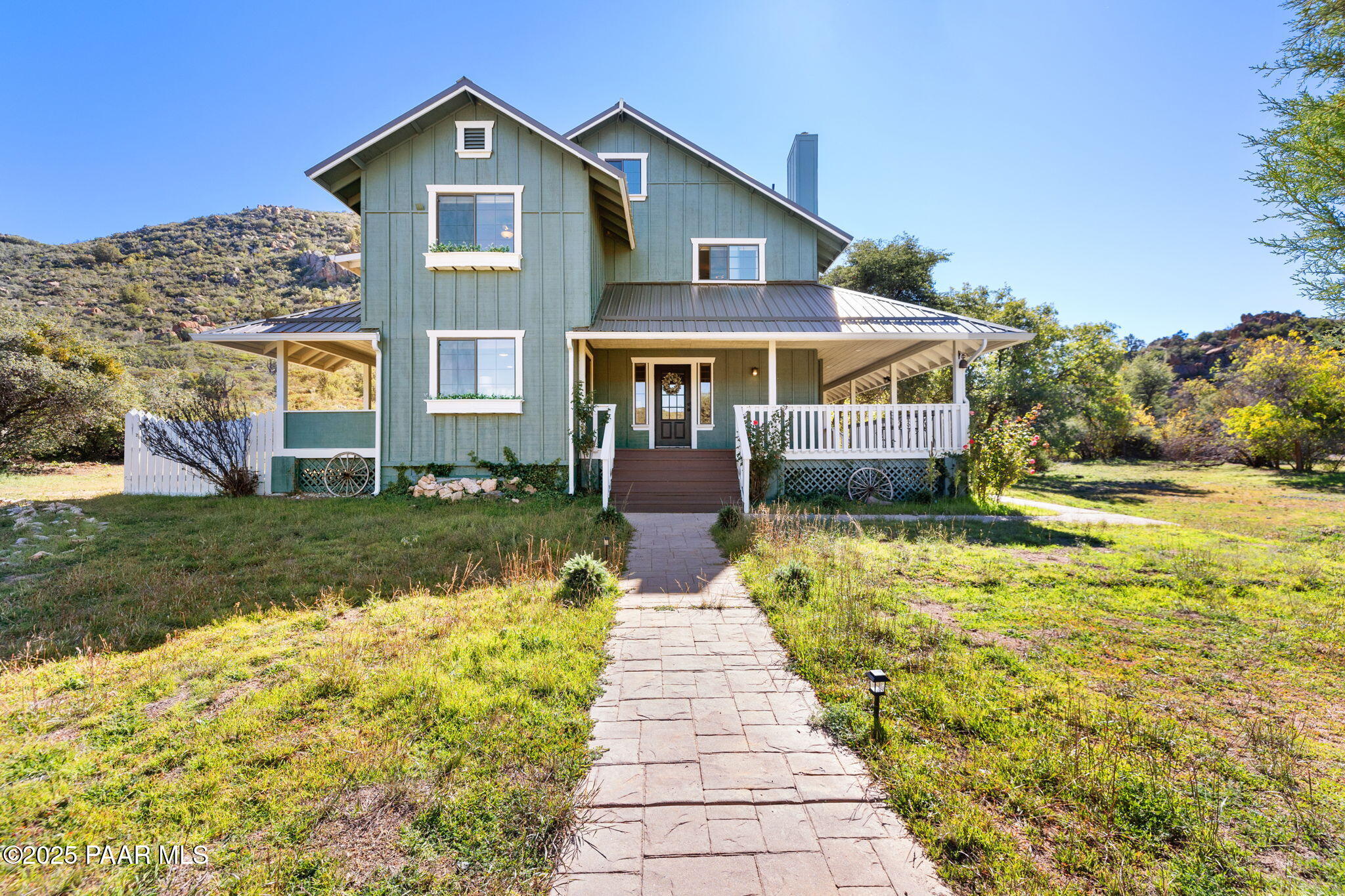 17441 West Fair Oaks Road Prescott, AZ 86305 - Photo 13 of 47 a front view of a house with a yard