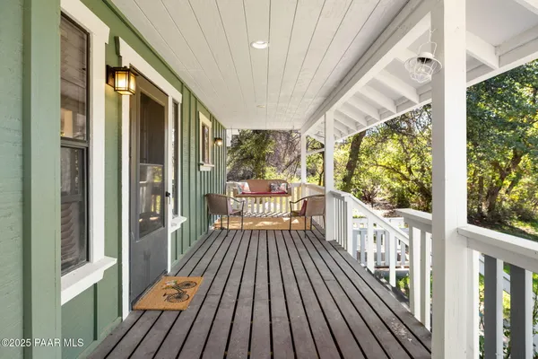 a view of a balcony with wooden floor
