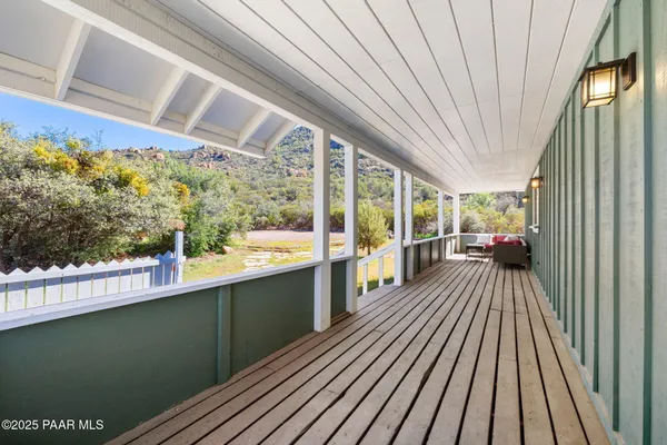 a view of a balcony with furniture