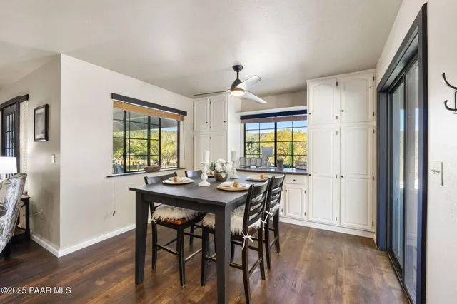 a view of a dining room with furniture and window