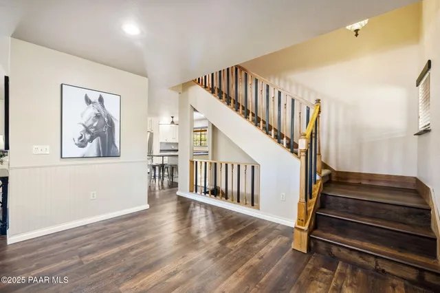 a view of staircase with wooden floor and stairs