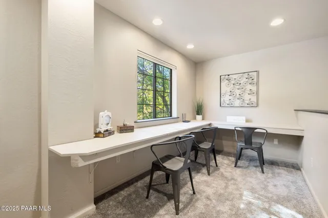 a dining room with a table and chairs