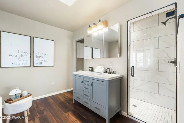 a kitchen with a cabinets and wooden floor