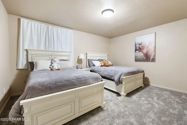 a bedroom with bed and window