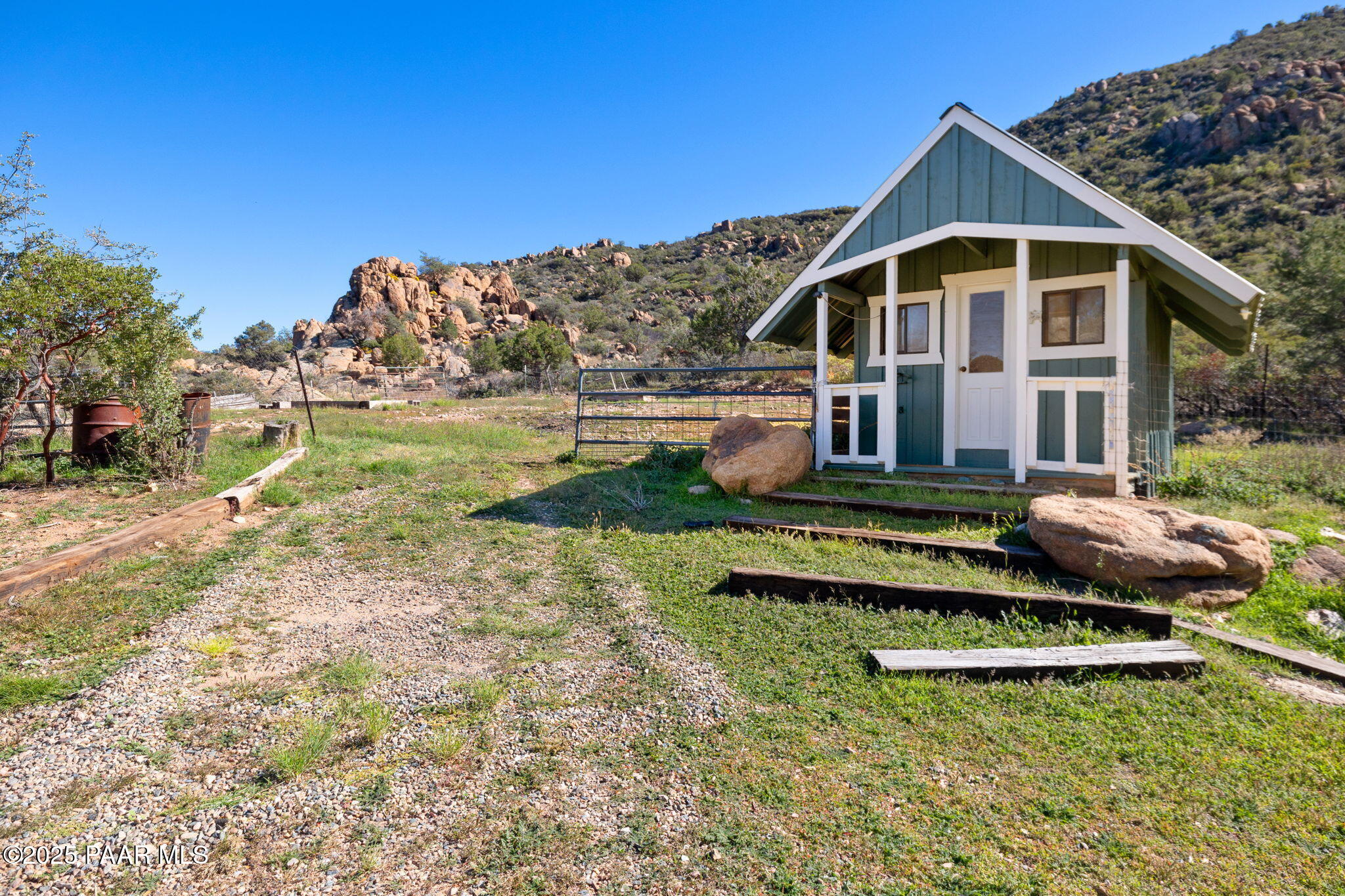 17441 West Fair Oaks Road Prescott, AZ 86305 - Photo 47 of 47 a front view of a house with a yard table and chairs