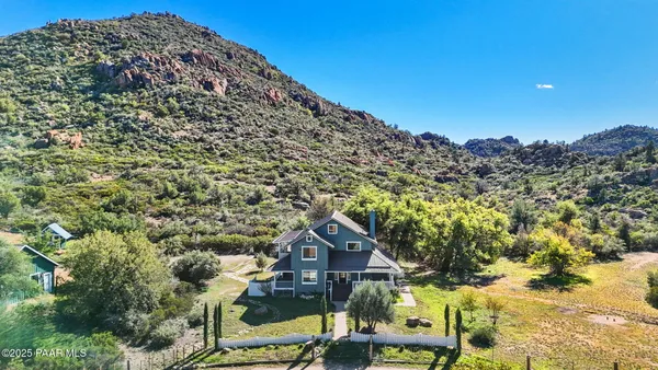 a view of a large building with a mountain in the background