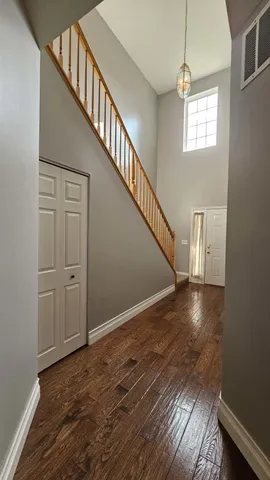 a view of an entryway with wooden floor
