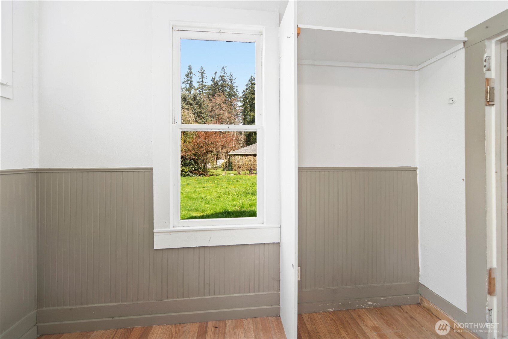 251 Arden Street Port Hadlock, WA 98339 - Photo 13 of 20 a view of an empty room with wooden floor and a window