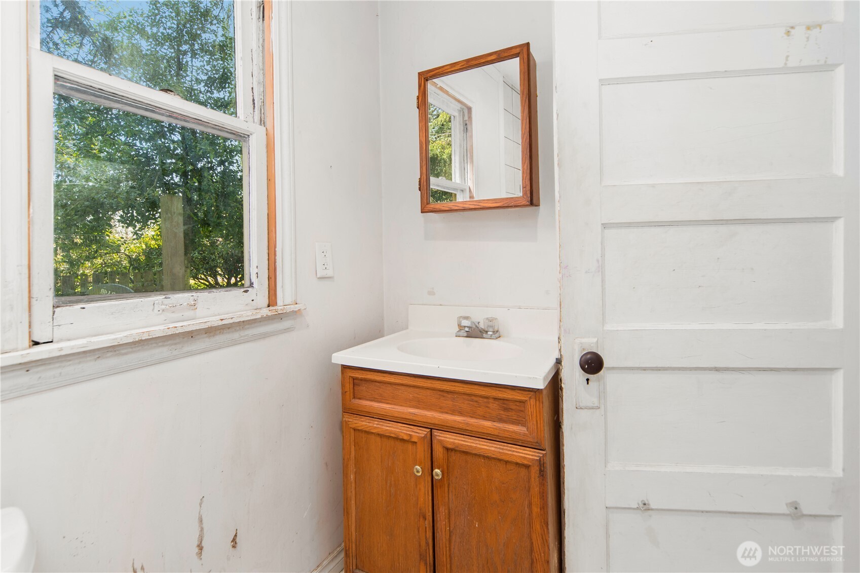251 Arden Street Port Hadlock, WA 98339 - Photo 14 of 20 a bathroom with a sink a toilet and a window