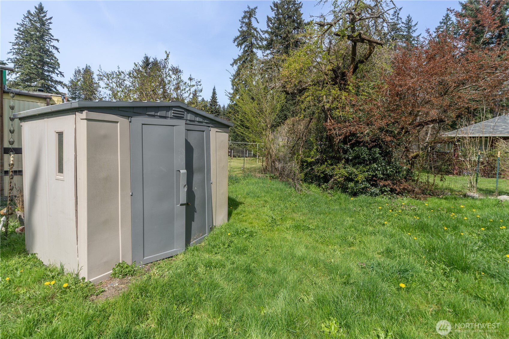 251 Arden Street Port Hadlock, WA 98339 - Photo 18 of 20 a view of a house with backyard and garden
