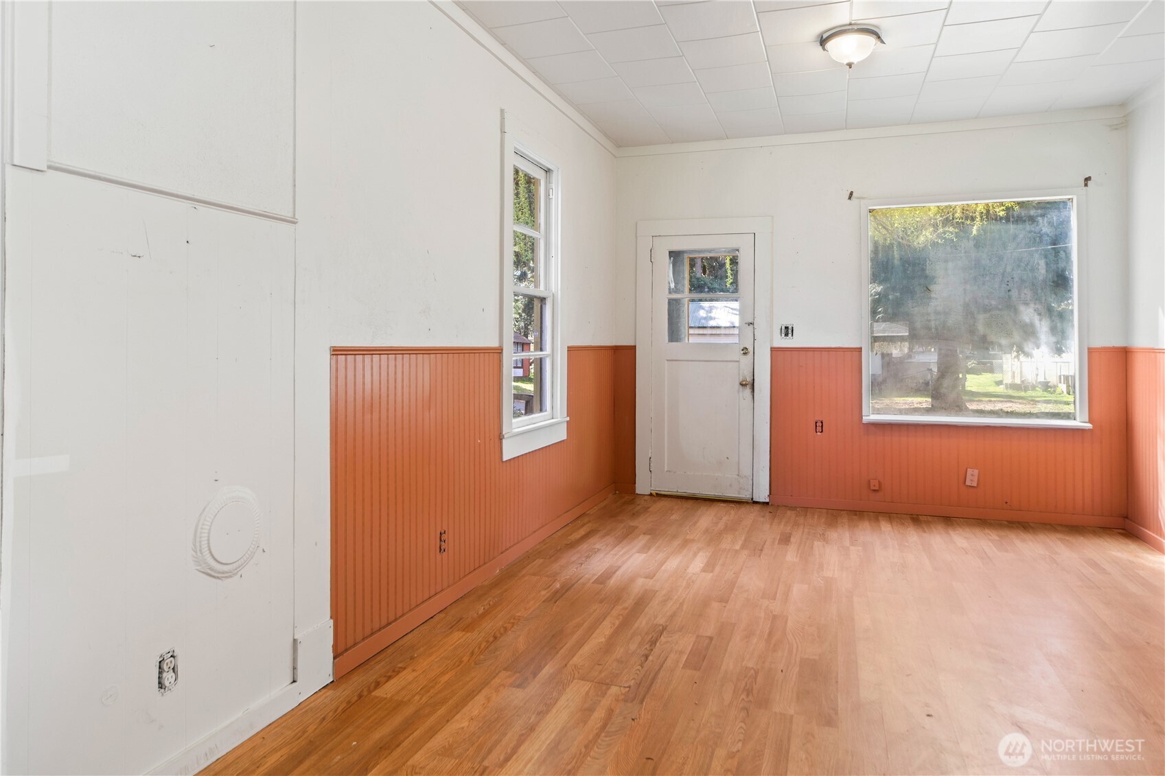 251 Arden Street Port Hadlock, WA 98339 - Photo 5 of 20 an empty room with wooden floor and windows