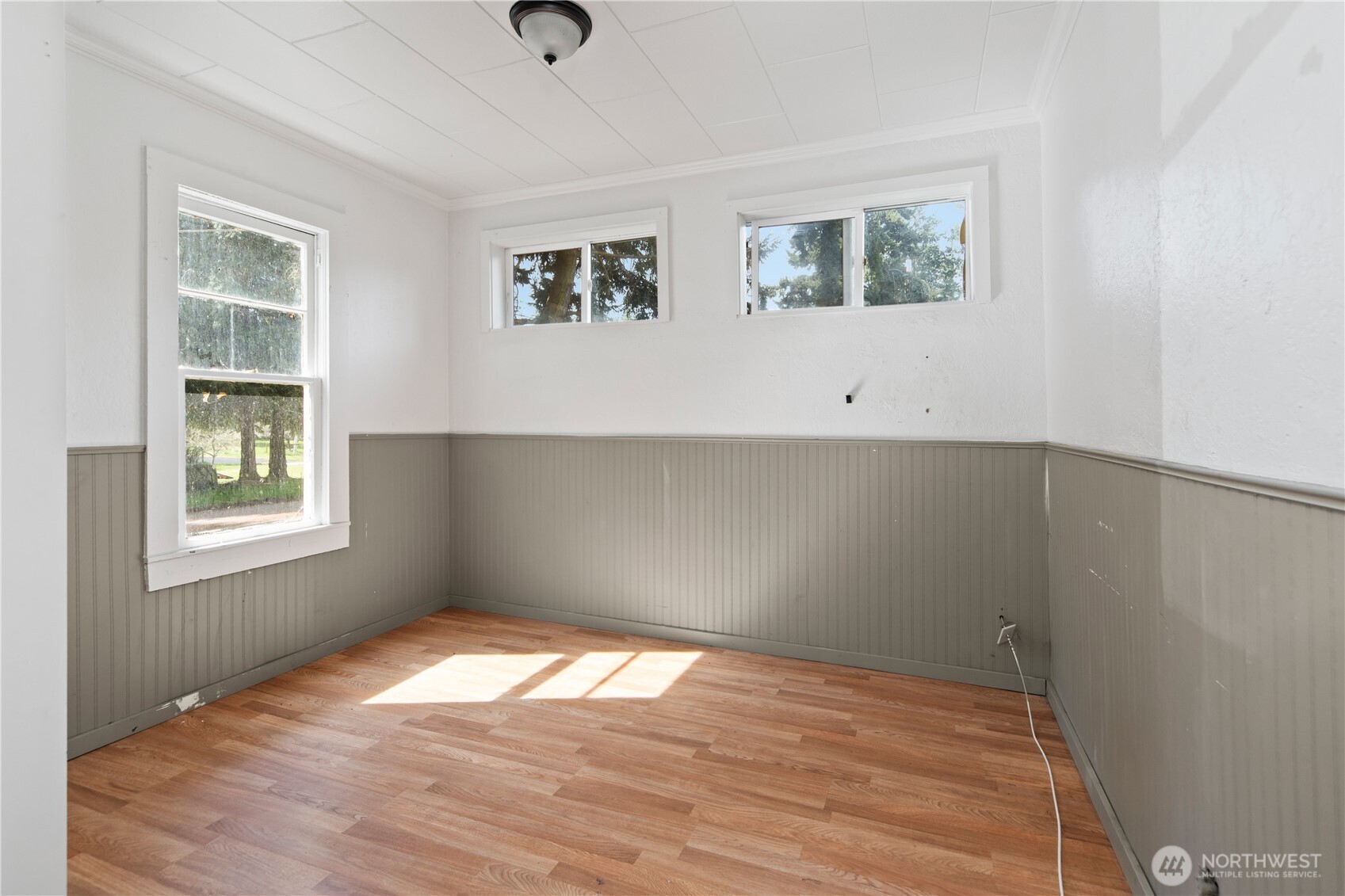 251 Arden Street Port Hadlock, WA 98339 - Photo 10 of 20 an empty room with wooden floor and windows
