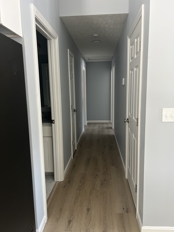 246 Holtshire Road, Unit LOT 3 Orange, MA 01364 - Photo 12 of 16 a view of a hallway with wooden floor
