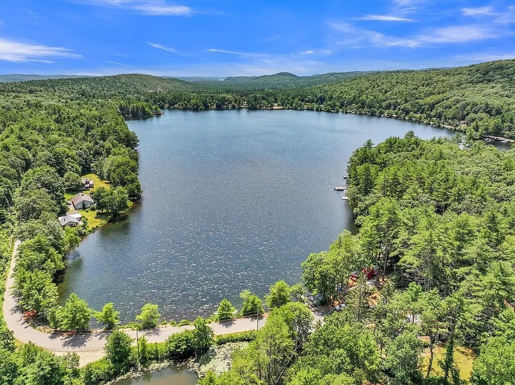 246 Holtshire Road, Unit LOT 3 Orange, MA 01364 - Photo 16 of 16 a view of a lake with a house in the background