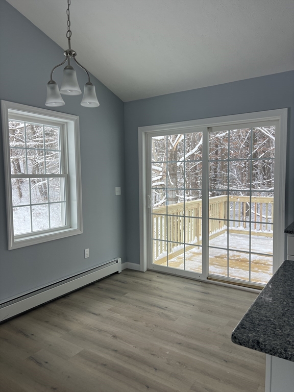246 Holtshire Road, Unit LOT 3 Orange, MA 01364 - Photo 3 of 16 a view of an empty room with wooden floor and a window