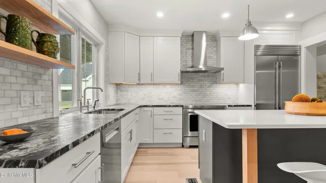 a kitchen with a sink and a shower