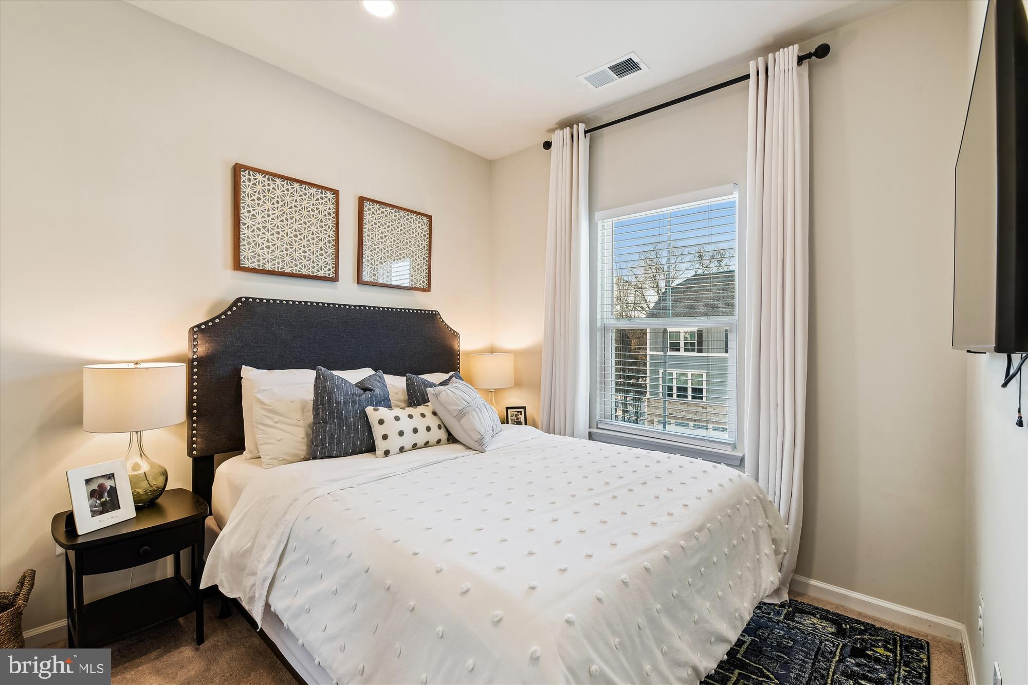 2907 Shaws Road Edgemere, MD 21219 - Photo 15 of 36 a bedroom with a bed and a window
