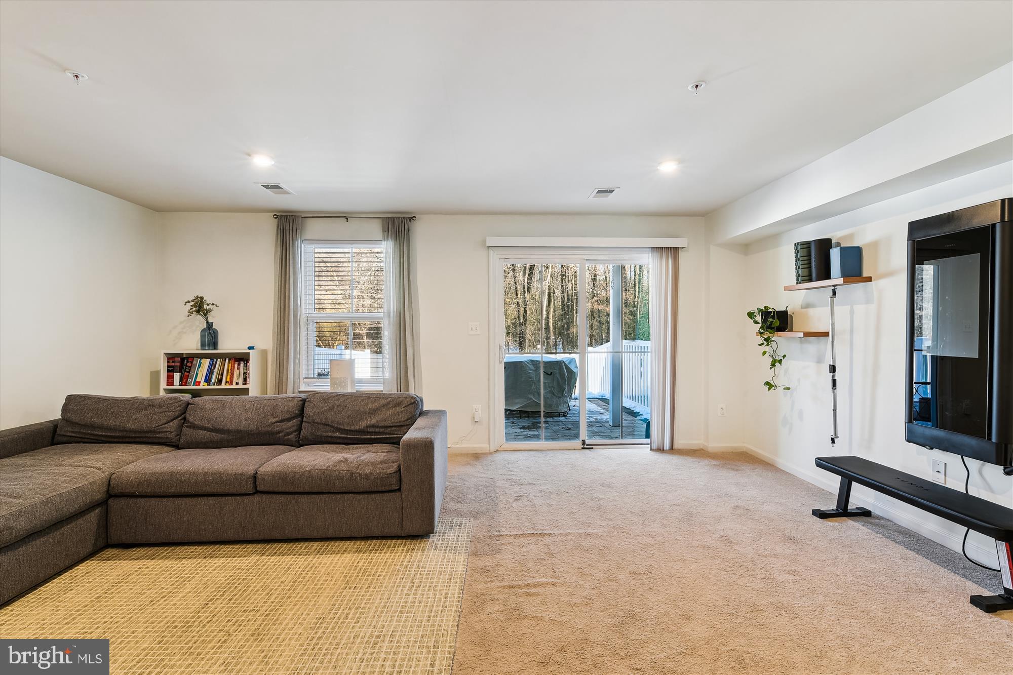 2907 Shaws Road Edgemere, MD 21219 - Photo 21 of 36 a living room with furniture and a flat screen tv