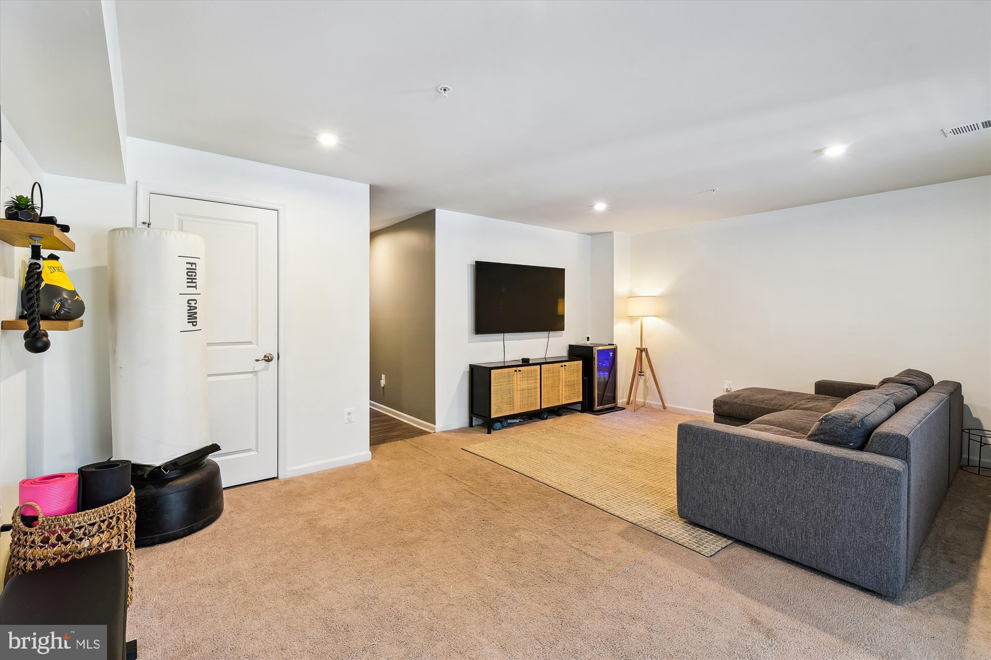 2907 Shaws Road Edgemere, MD 21219 - Photo 22 of 36 a living room with furniture and a flat screen tv