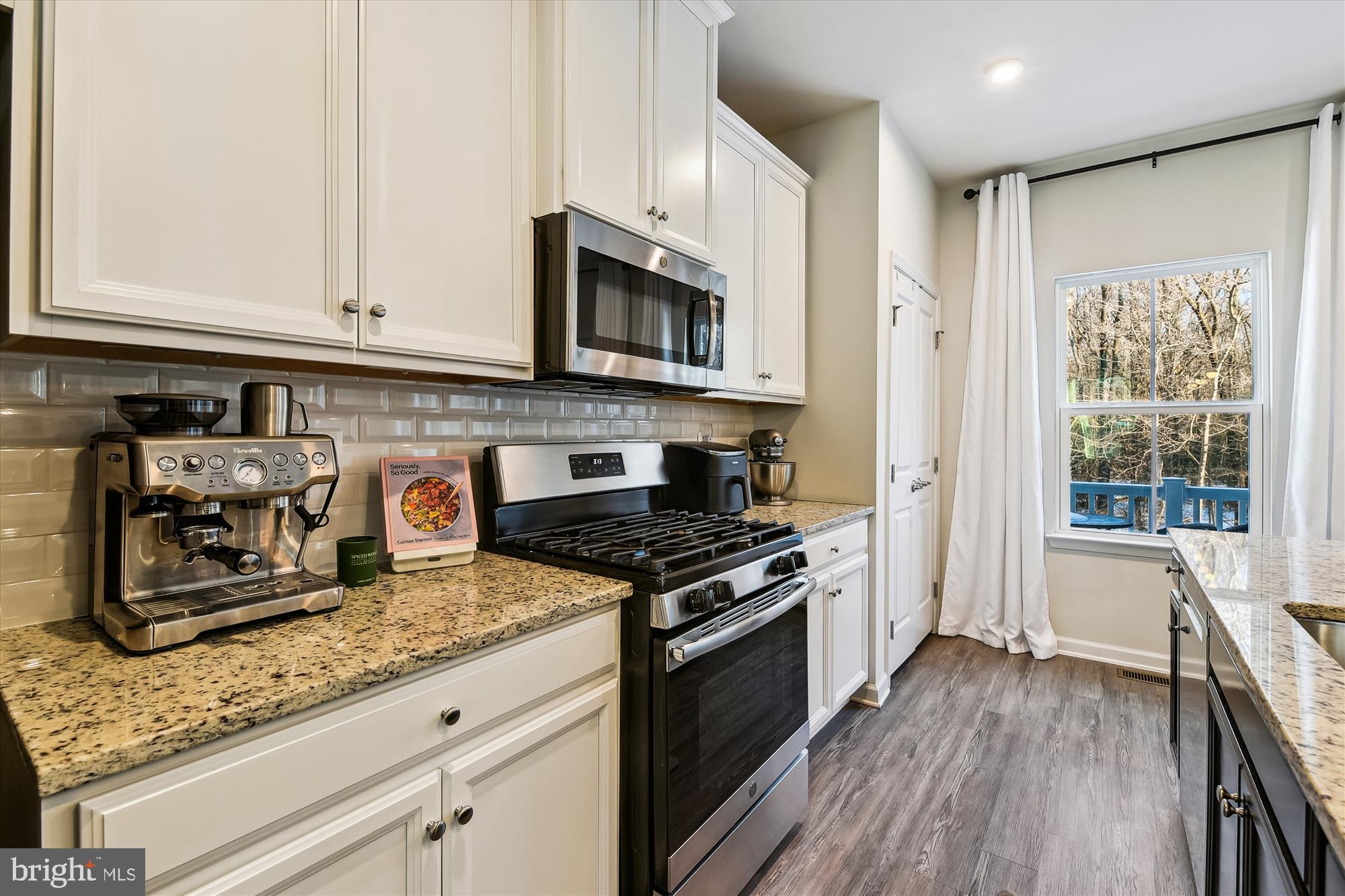 2907 Shaws Road Edgemere, MD 21219 - Photo 8 of 36 a kitchen with stainless steel appliances granite countertop a stove a sink and a microwave