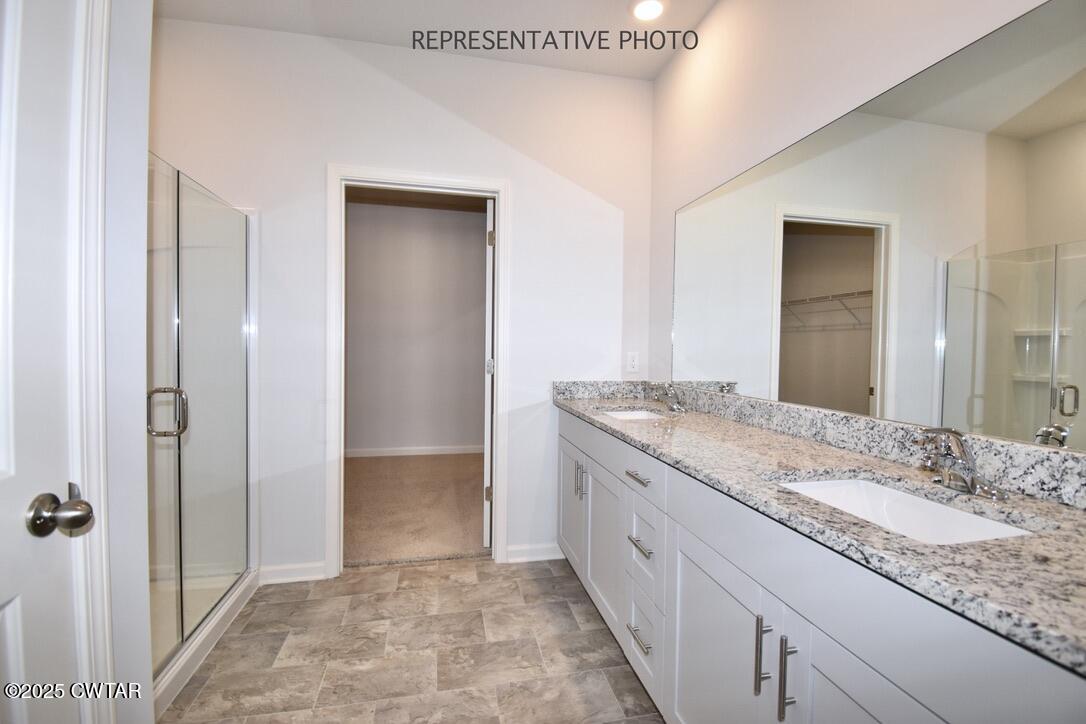 67 Clarendon Cove Jackson, TN 38305 - Photo 11 of 19 a bathroom with a granite countertop sink and a mirror
