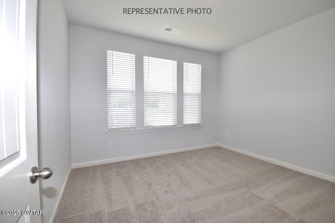 67 Clarendon Cove Jackson, TN 38305 - Photo 14 of 19 an empty room with windows