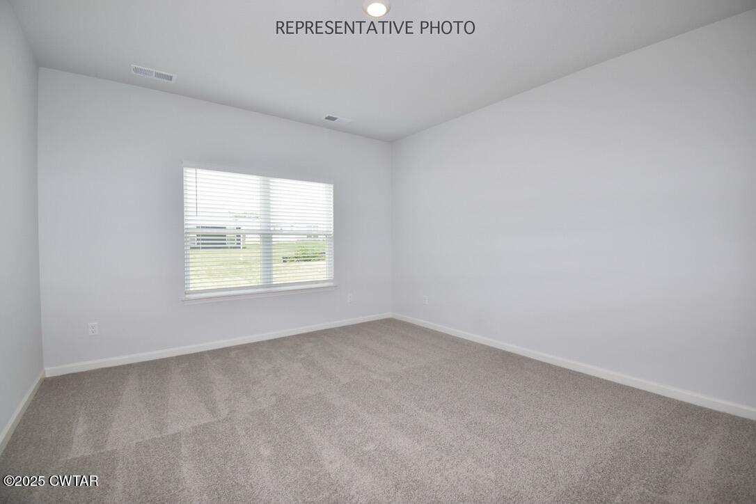 67 Clarendon Cove Jackson, TN 38305 - Photo 9 of 19 an empty room with a window