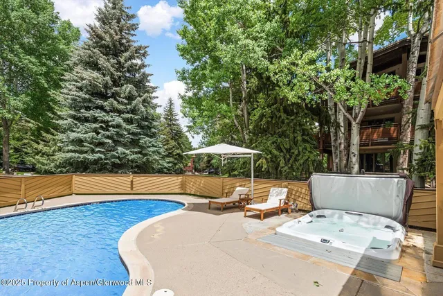 a view of a swimming pool with a lounge chairs