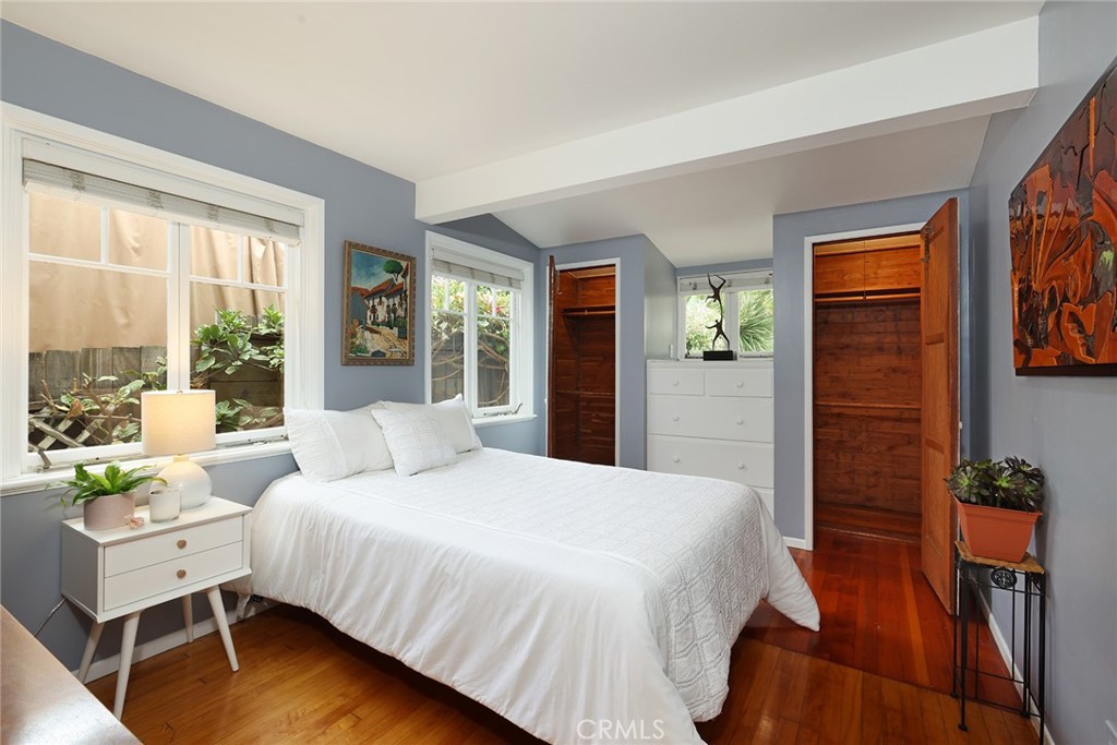 556 Through Street Laguna Beach, CA 92651 - Photo 14 of 30 a bedroom with a bed and wooden floor