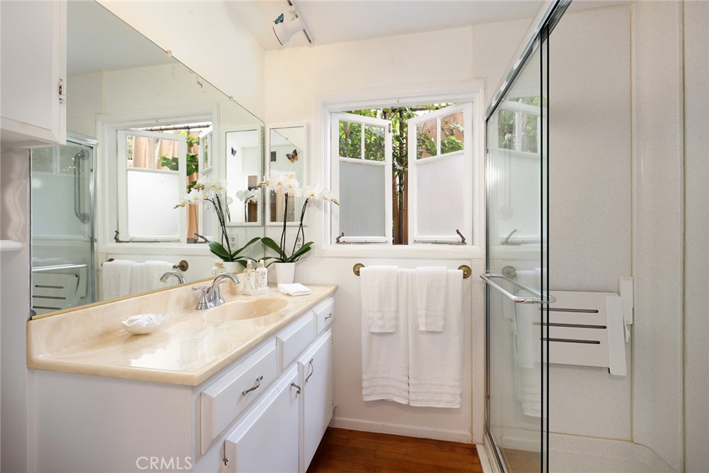 556 Through Street Laguna Beach, CA 92651 - Photo 16 of 30 a bathroom with a sink and a mirror