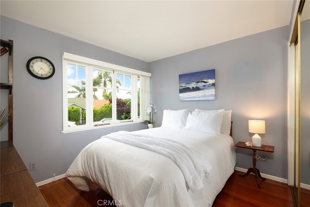 556 Through Street Laguna Beach, CA 92651 - Photo 17 of 30 a bedroom with a bed and a window